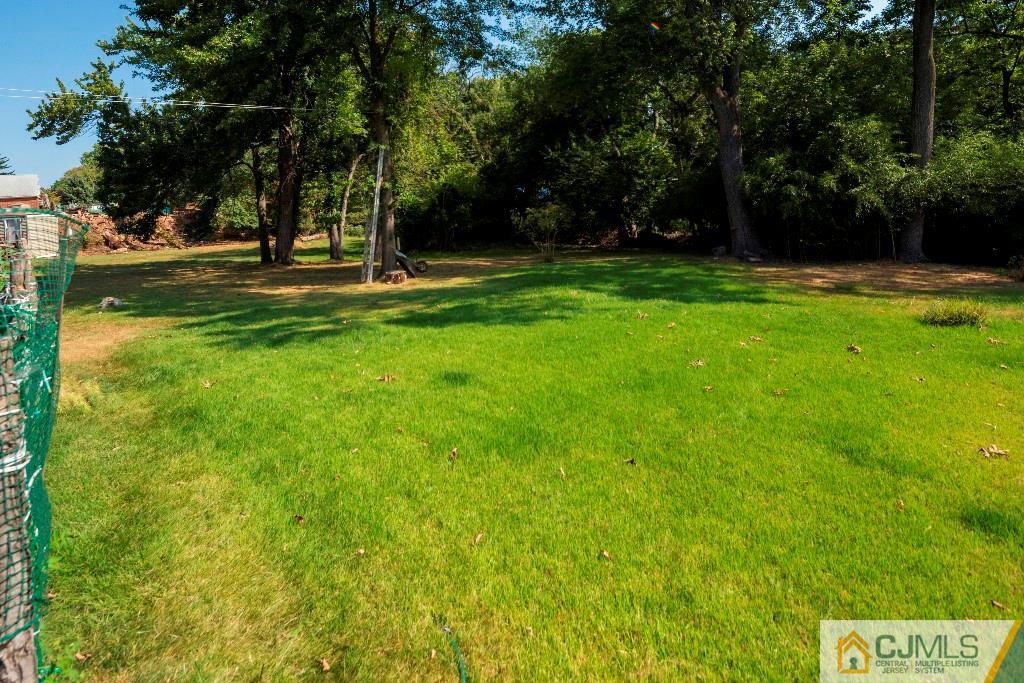 27 Old Post Road Edison, NJ 08817 - Photo 23 of 25 a view of outdoor space with deck and trees