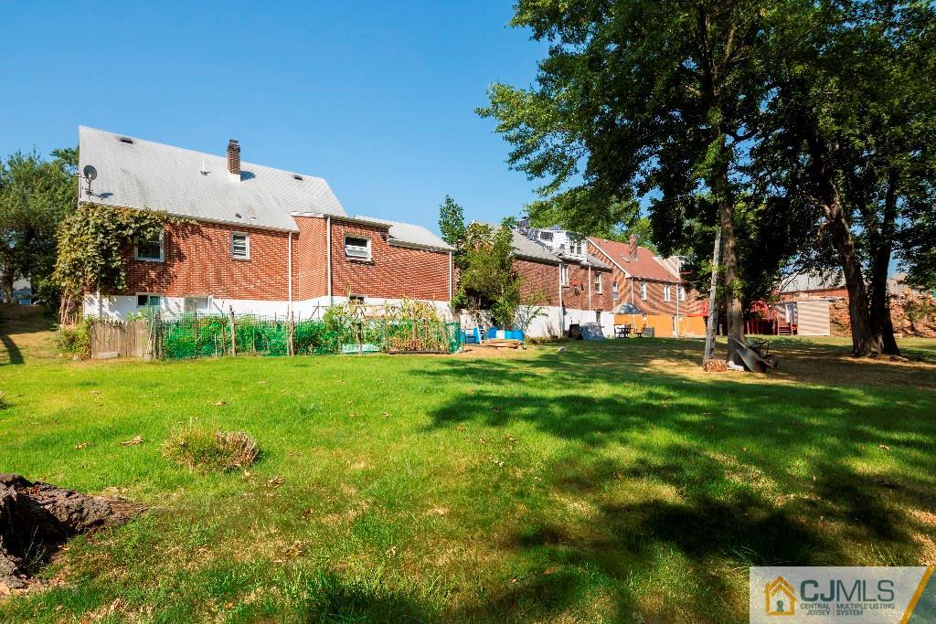 27 Old Post Road Edison, NJ 08817 - Photo 24 of 25 a front view of a house with garden