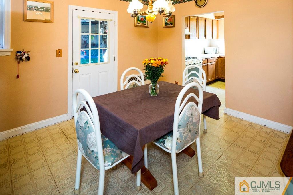 27 Old Post Road Edison, NJ 08817 - Photo 5 of 25 a view of a dining room with furniture and chandelier