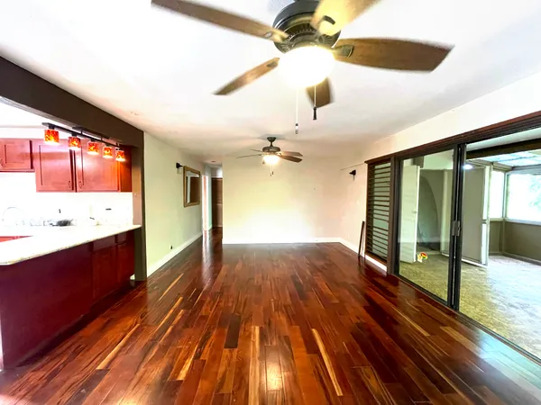 a spacious bathroom with a sink and a large mirror