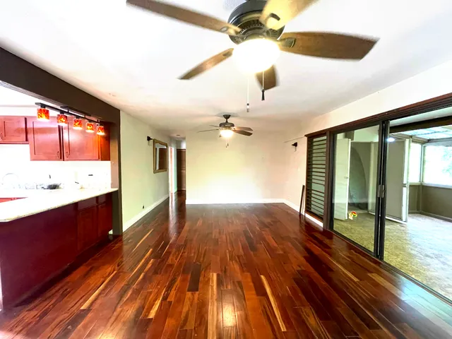 a spacious bathroom with a sink and a large mirror