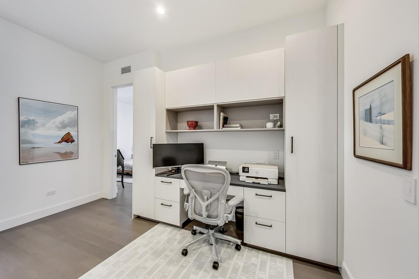 28 North Carpenter Street, Unit PHN Chicago, IL 60607 - Photo 12 of 14 a view of a workspace with furniture and a window