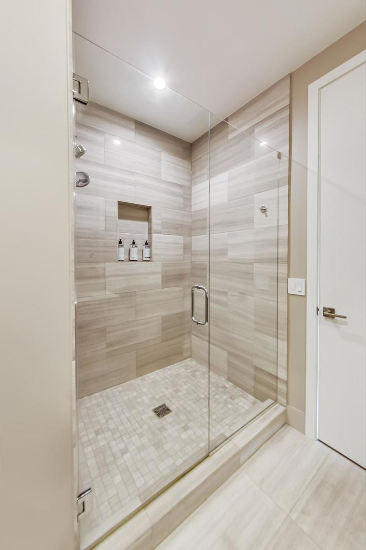 28 North Carpenter Street, Unit PHN Chicago, IL 60607 - Photo 7 of 14 a bathroom with a shower