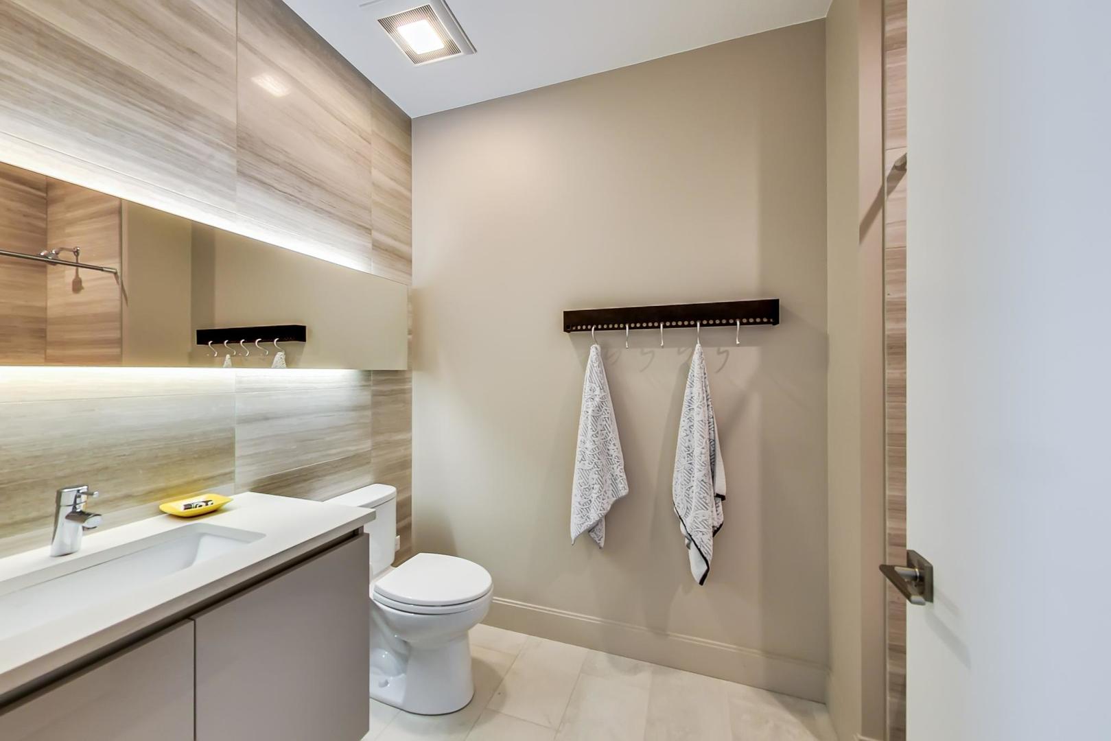 28 North Carpenter Street, Unit PHN Chicago, IL 60607 - Photo 9 of 14 a bathroom with a granite countertop sink toilet and shower