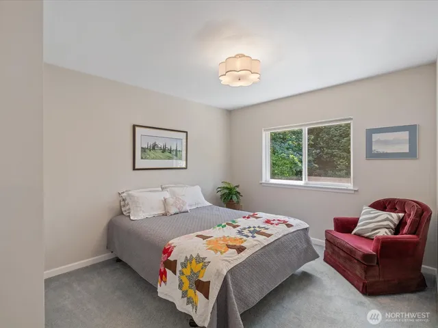 a bedroom with a bed and a couch