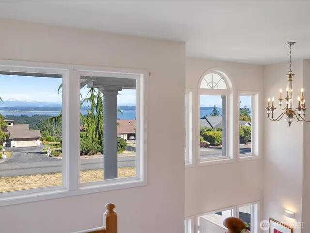 a view of hall way with furniture