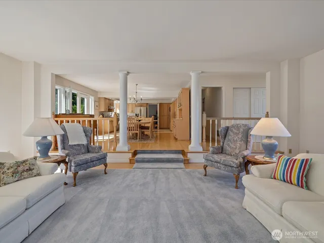 a living room with furniture and a lamp