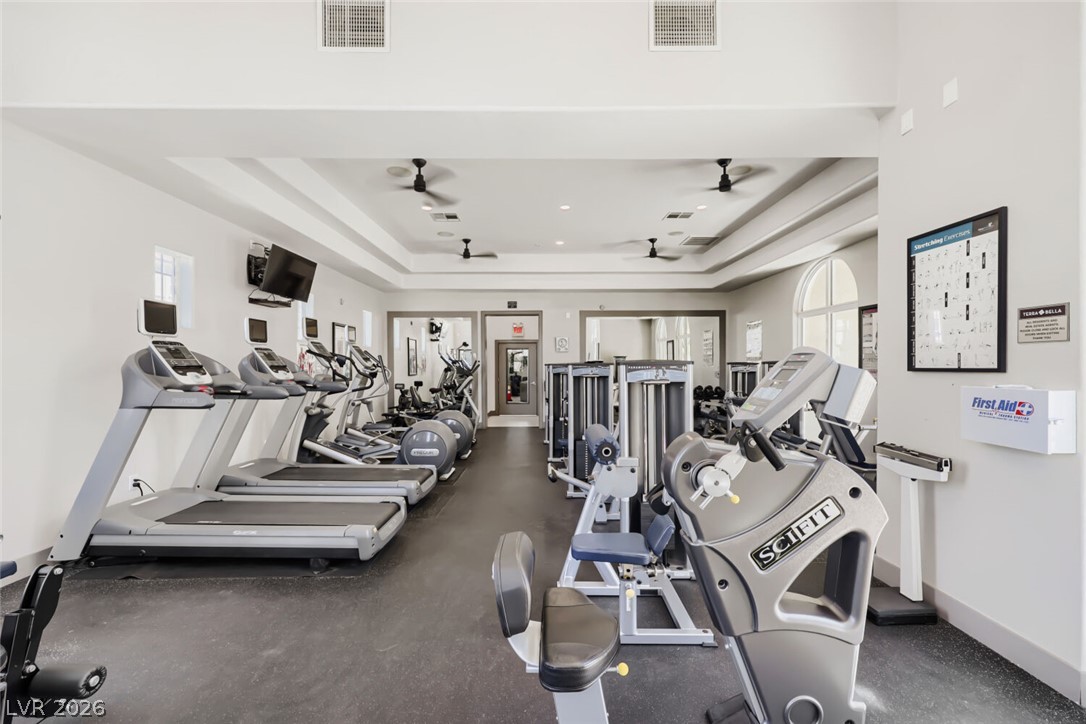 2555 Hampton Road, Unit 9301 Henderson, NV 89052 - Photo 30 of 36 Equipped for optimal fitness, this gym space features an array of modern workout machines and cool ceiling fans.