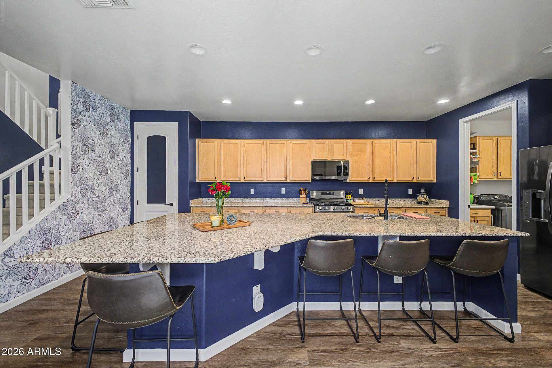 3940 East Turley Street Gilbert, AZ 85295 - Photo 14 of 50 a kitchen with a kitchen island island furniture and a large window