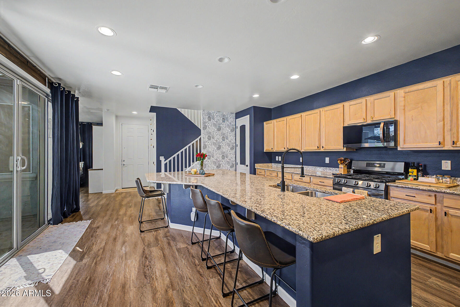 3940 East Turley Street Gilbert, AZ 85295 - Photo 15 of 50 a kitchen with granite countertop lots of counter top space and stainless steel appliances