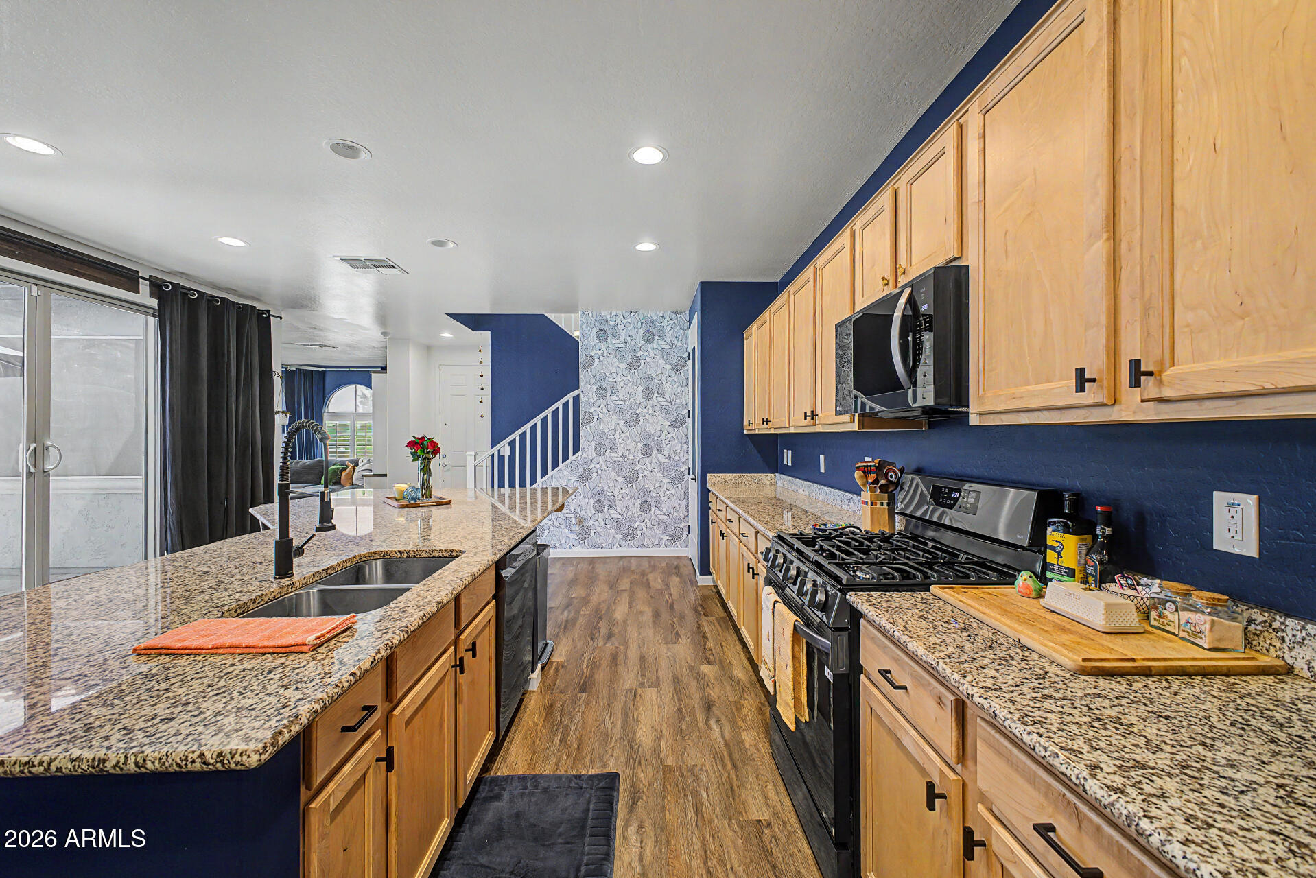 3940 East Turley Street Gilbert, AZ 85295 - Photo 17 of 50 a kitchen with stainless steel appliances granite countertop a sink stove and refrigerator