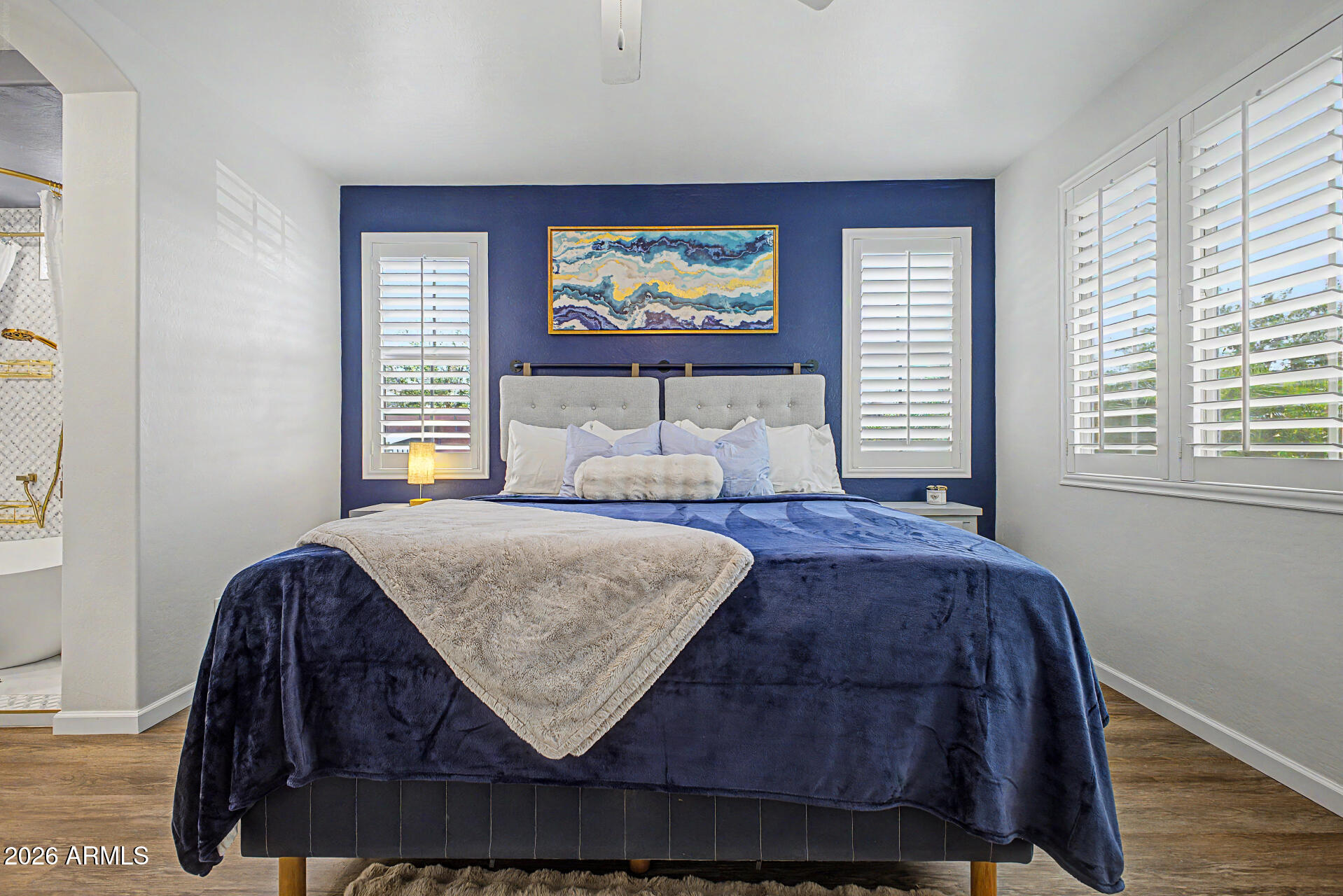 3940 East Turley Street Gilbert, AZ 85295 - Photo 21 of 50 a bed sitting in a bedroom next to a window