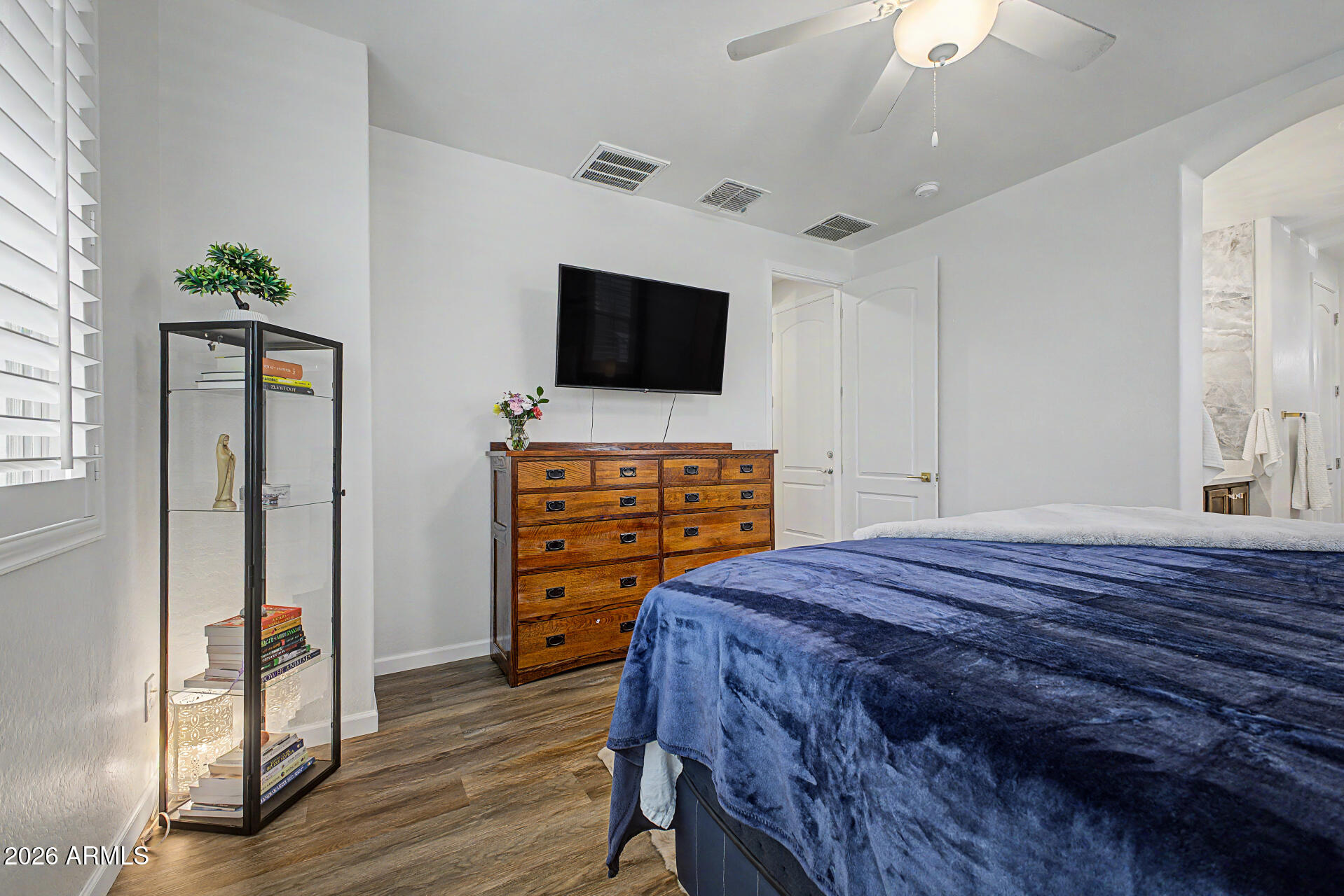 3940 East Turley Street Gilbert, AZ 85295 - Photo 22 of 50 a bedroom with a bed and a flat screen tv