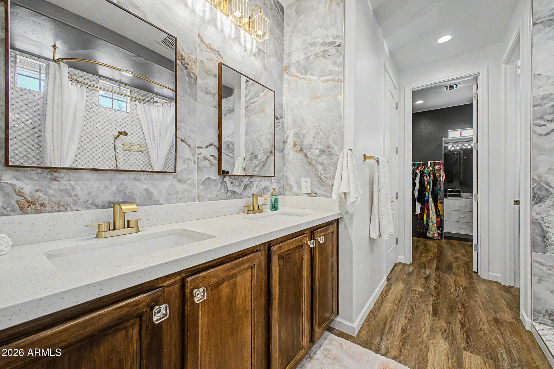 3940 East Turley Street Gilbert, AZ 85295 - Photo 23 of 50 a bathroom with a sink a mirror and a shower