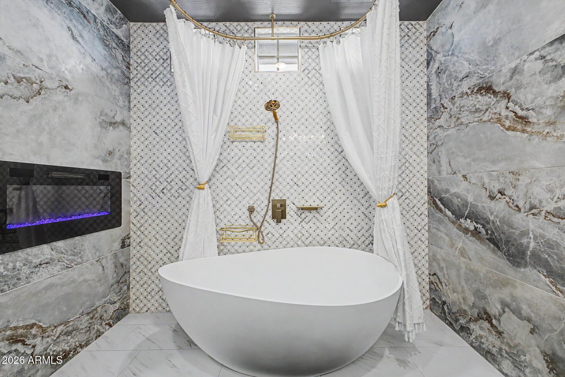 3940 East Turley Street Gilbert, AZ 85295 - Photo 24 of 50 a white bath tub sitting in a bathroom
