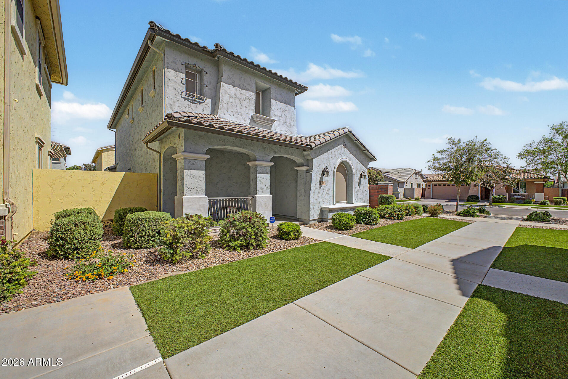 3940 East Turley Street Gilbert, AZ 85295 - Photo 2 of 50 a front view of a house with a yard