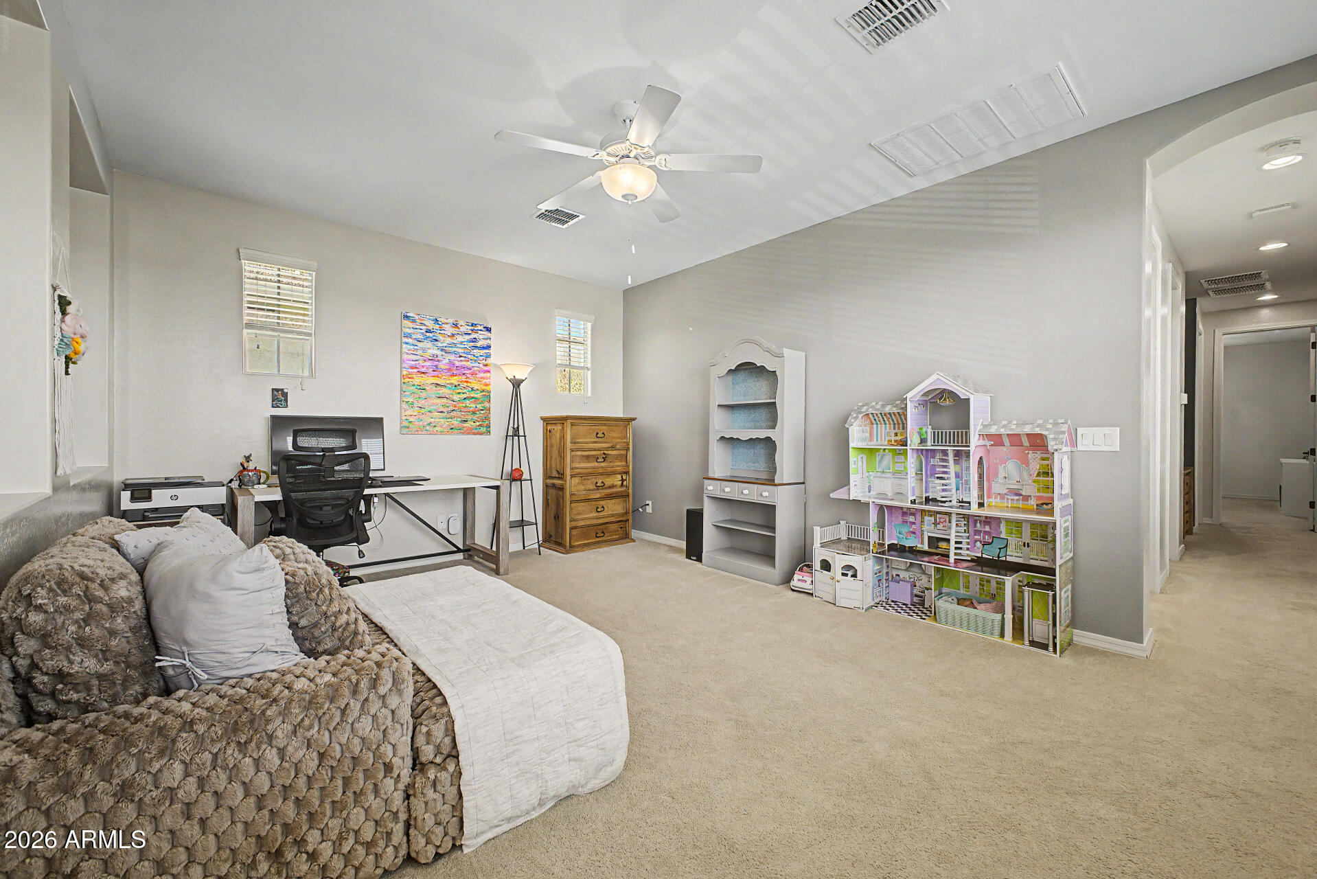 3940 East Turley Street Gilbert, AZ 85295 - Photo 27 of 50 a bedroom with furniture and a chair