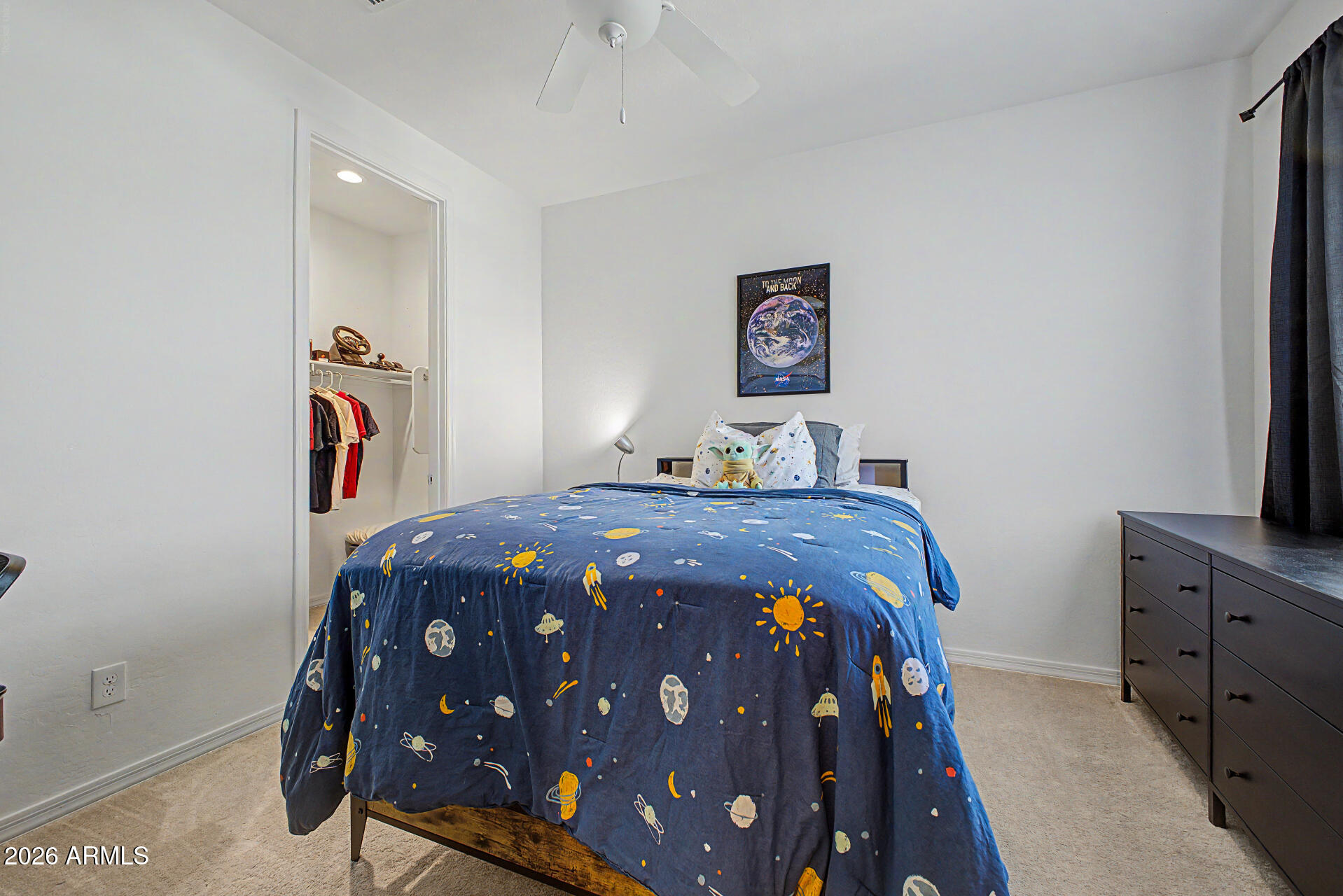 3940 East Turley Street Gilbert, AZ 85295 - Photo 34 of 50 a bedroom with a bed and a flat tv screen on wall