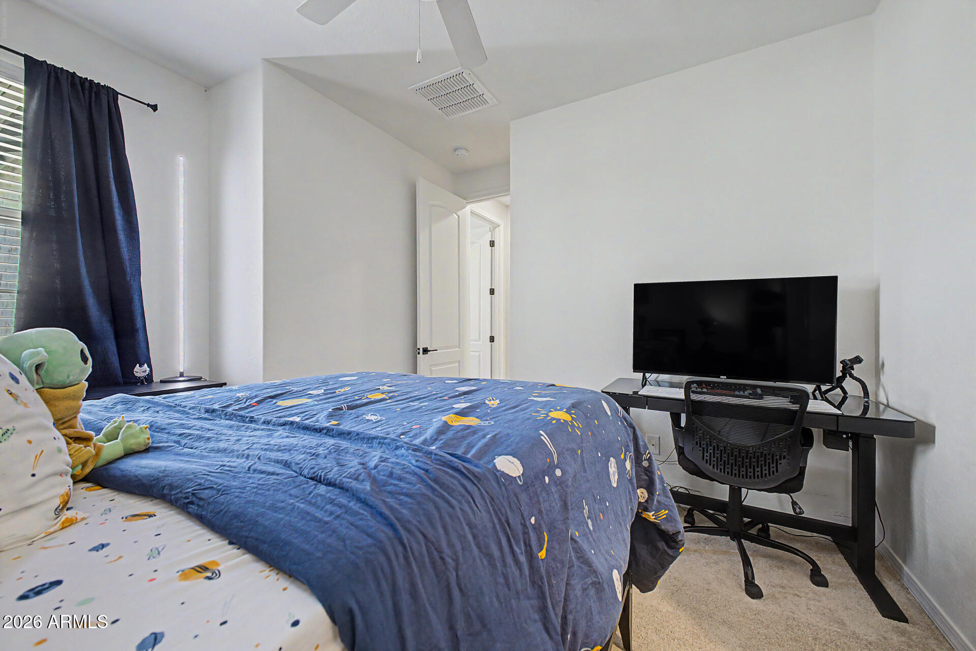 3940 East Turley Street Gilbert, AZ 85295 - Photo 35 of 50 a bedroom with a bed and a flat screen tv