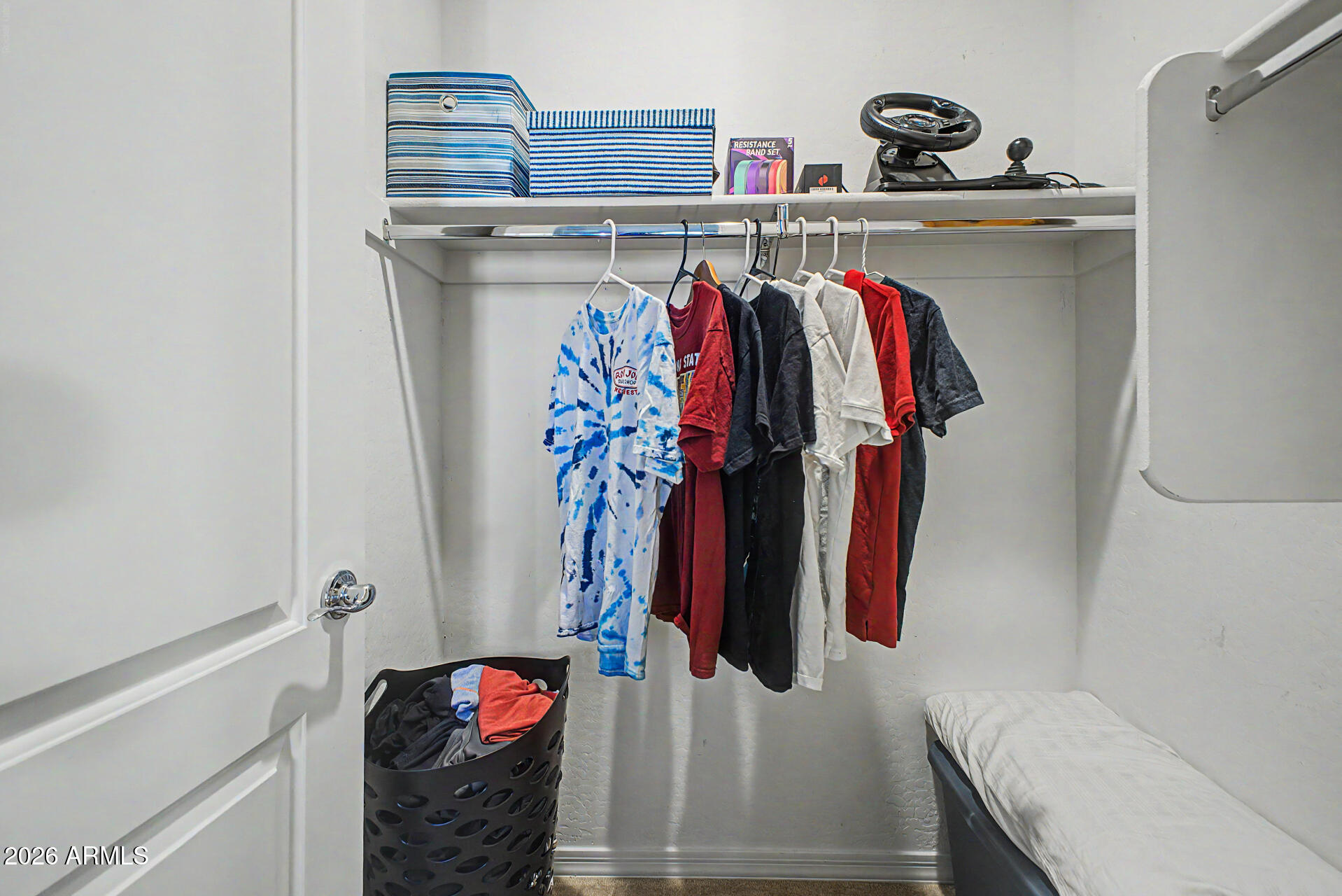 3940 East Turley Street Gilbert, AZ 85295 - Photo 36 of 50 a view of walk in closet with clothes and shoes