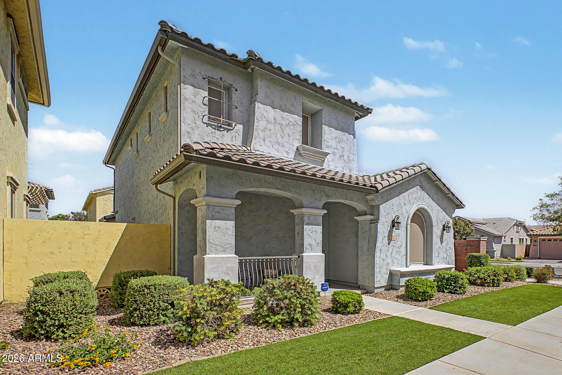 3940 East Turley Street Gilbert, AZ 85295 - Photo 3 of 50 a front view of a house with a garden