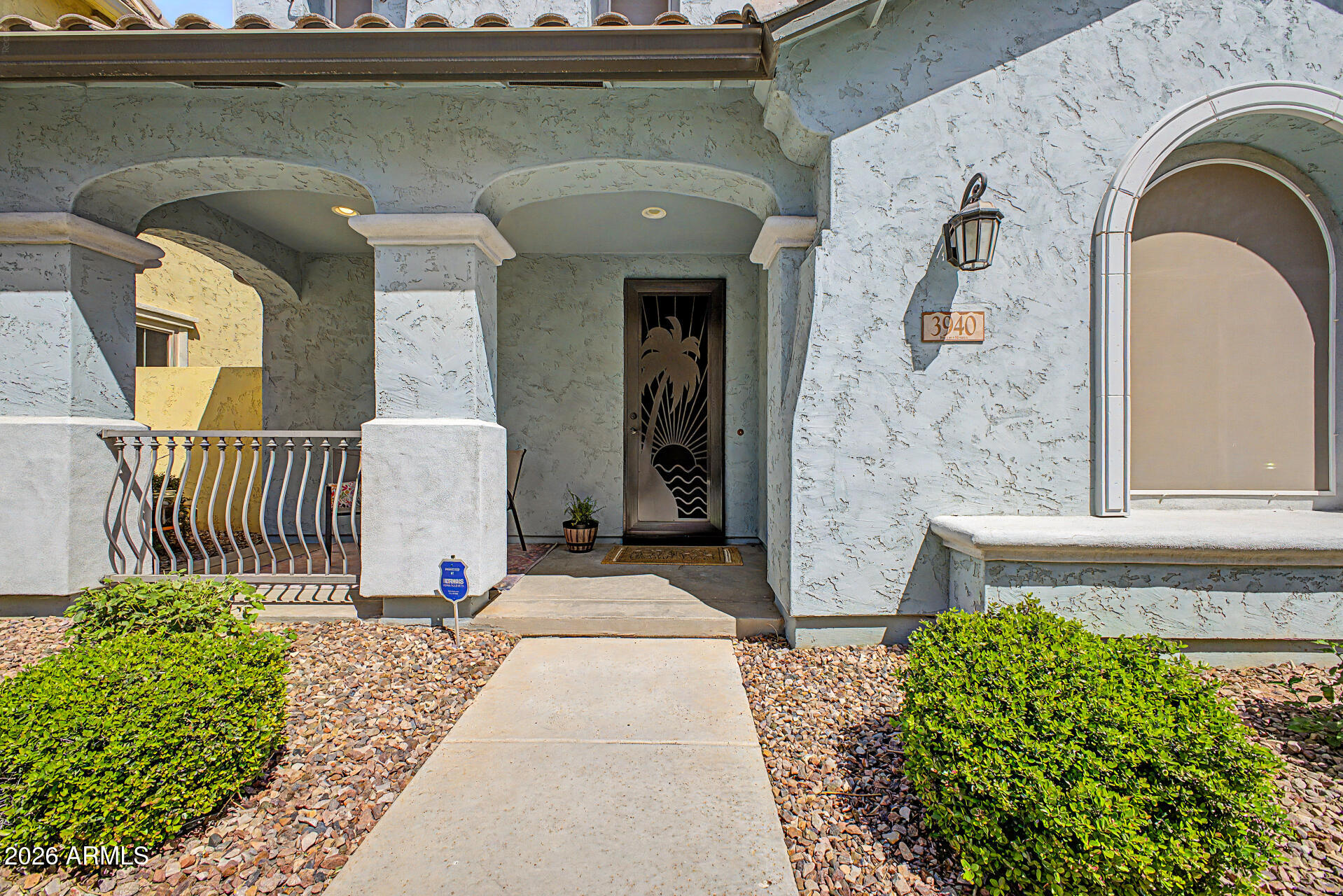 3940 East Turley Street Gilbert, AZ 85295 - Photo 6 of 50 a front view of a house with a garden