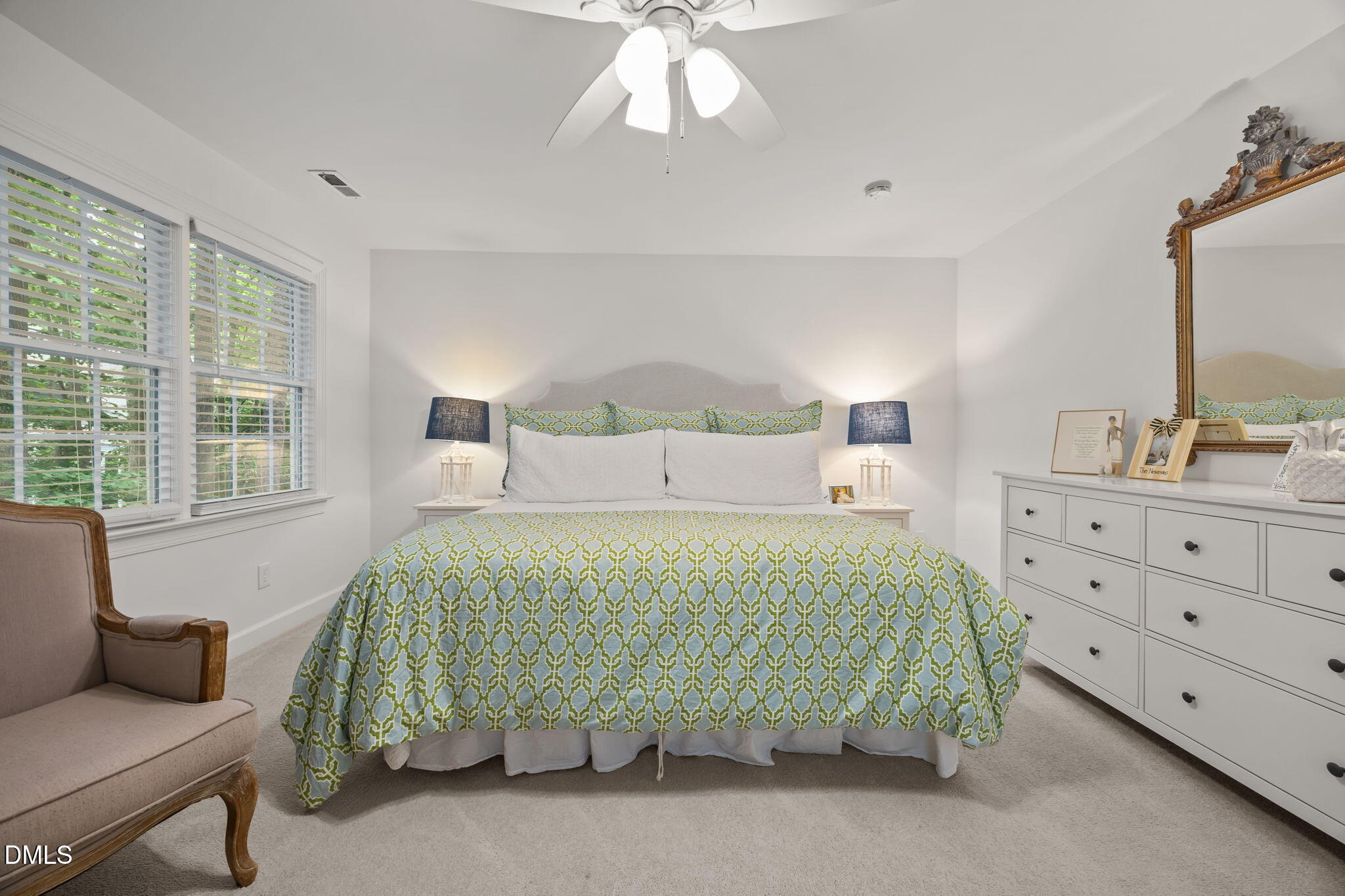 562 Weathergreen Drive Raleigh, NC 27615 - Photo 18 of 47 a bedroom with a bed and a dresser