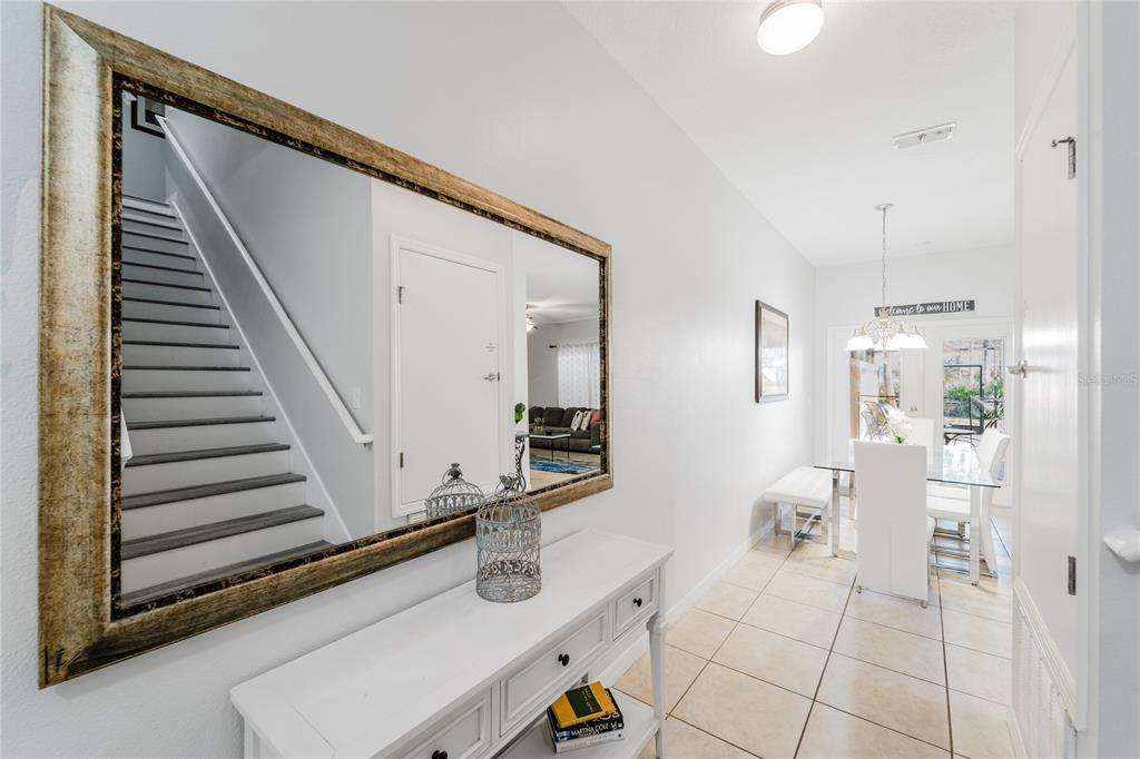 8961 Majesty Palm Road Kissimmee, FL 34747 - Photo 6 of 40 a bathroom with a sink mirror and vanity