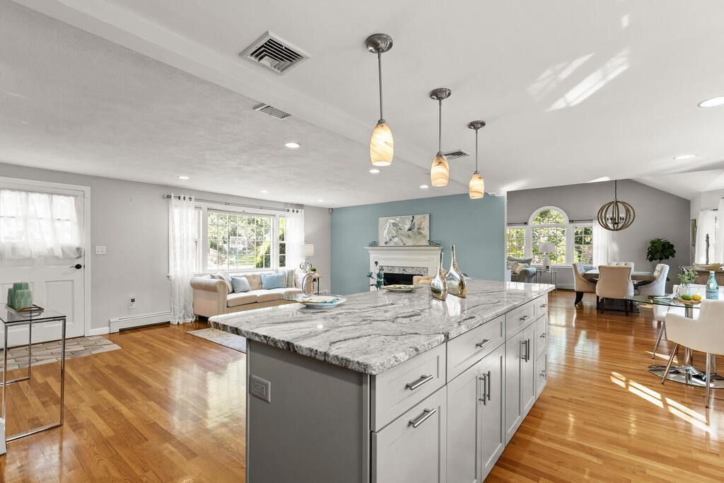 33 Doncaster Circle Lynnfield, MA 01940 - Photo 14 of 31 a large kitchen with stainless steel appliances kitchen island granite countertop a sink and cabinets