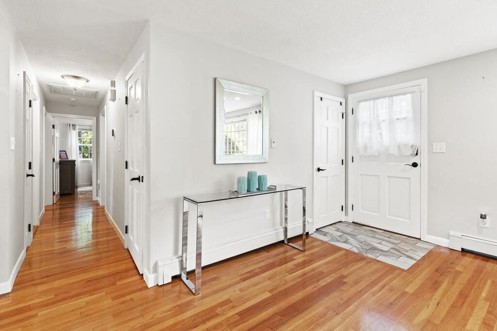 33 Doncaster Circle Lynnfield, MA 01940 - Photo 15 of 31 a view of a room with wooden floor and white doors