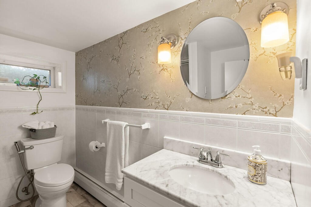 33 Doncaster Circle Lynnfield, MA 01940 - Photo 20 of 31 a bathroom with a granite countertop toilet sink and mirror