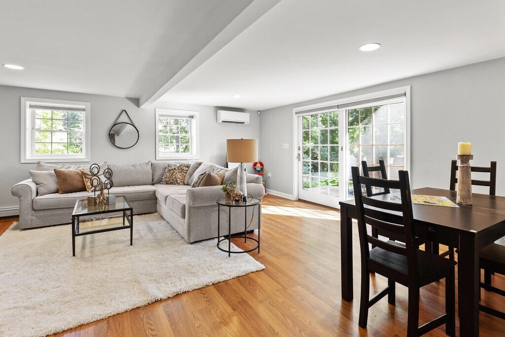 33 Doncaster Circle Lynnfield, MA 01940 - Photo 25 of 31 a living room with furniture wooden floor and a table