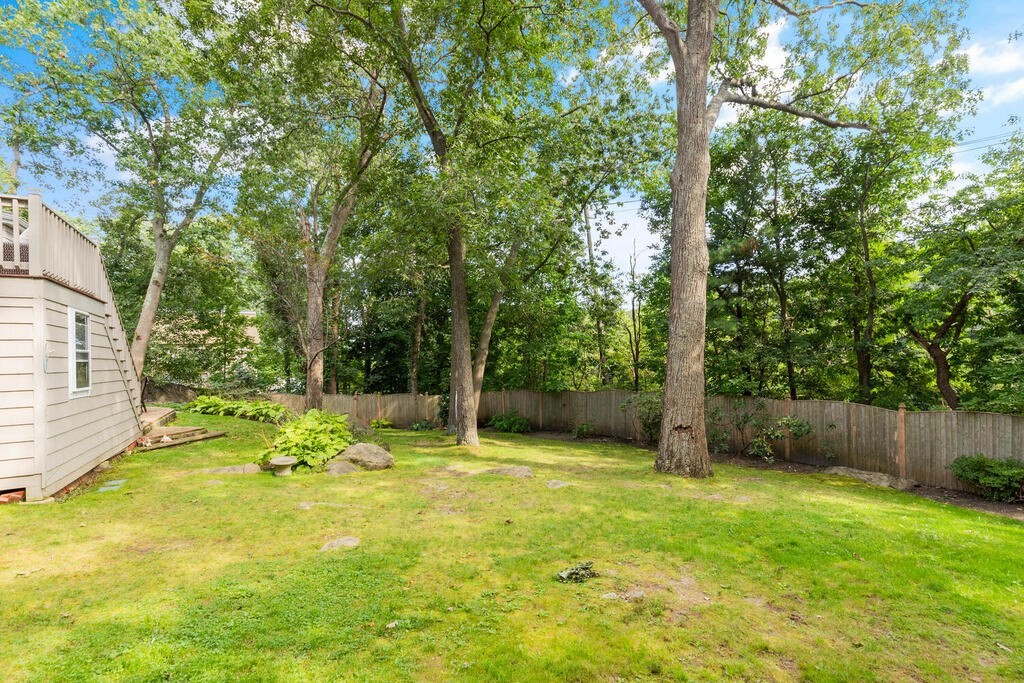 33 Doncaster Circle Lynnfield, MA 01940 - Photo 28 of 31 a view of a backyard with a small cabin