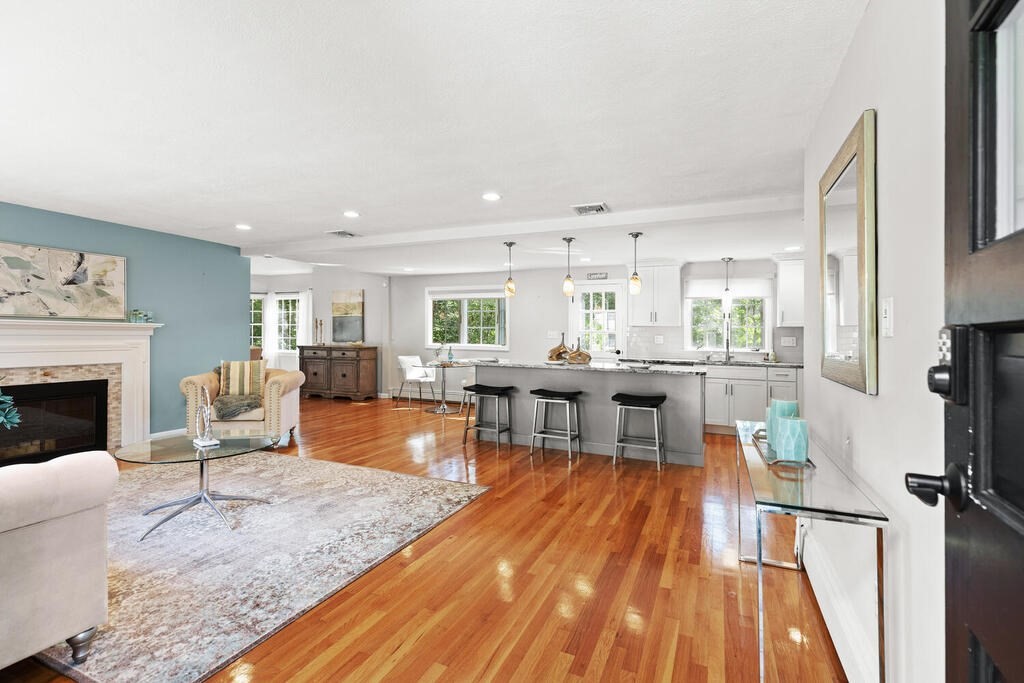 33 Doncaster Circle Lynnfield, MA 01940 - Photo 3 of 31 a living room with furniture and a fireplace