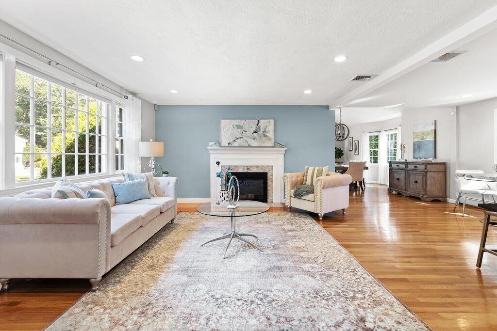 33 Doncaster Circle Lynnfield, MA 01940 - Photo 4 of 31 a living room with furniture and a fireplace