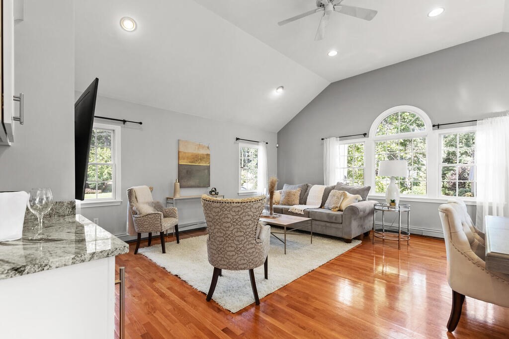 33 Doncaster Circle Lynnfield, MA 01940 - Photo 7 of 31 a living room with furniture and a large window