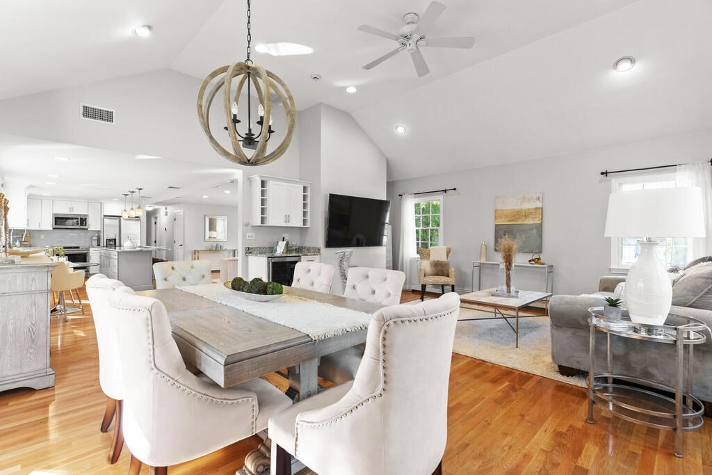 33 Doncaster Circle Lynnfield, MA 01940 - Photo 9 of 31 a view of a dining room with furniture a chandelier and wooden floor