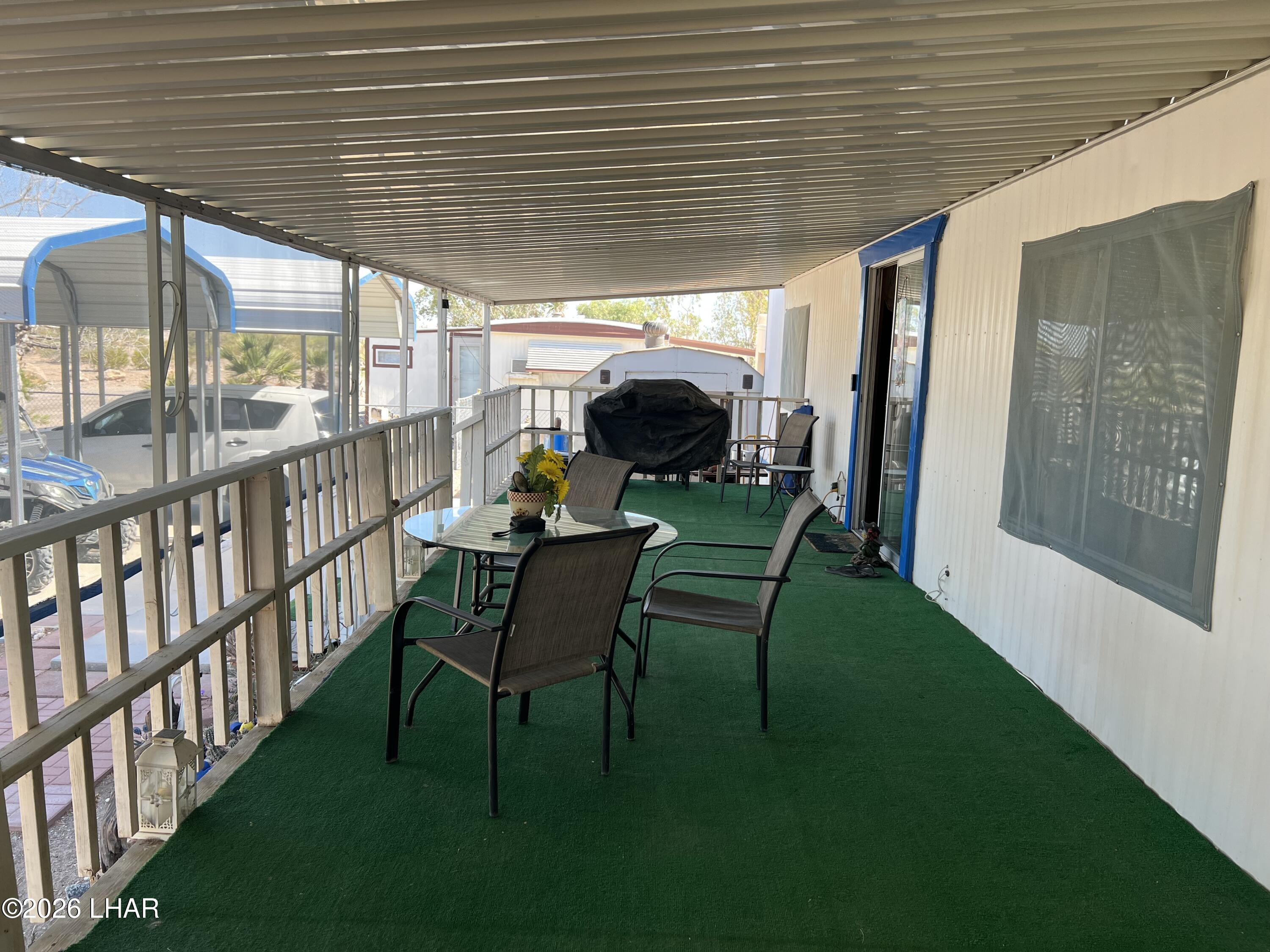 776 Granada Drive Quartzsite, AZ 85346 - Photo 15 of 39 Approx. 10'x36' Covered Front Deck to Front Door and Slider