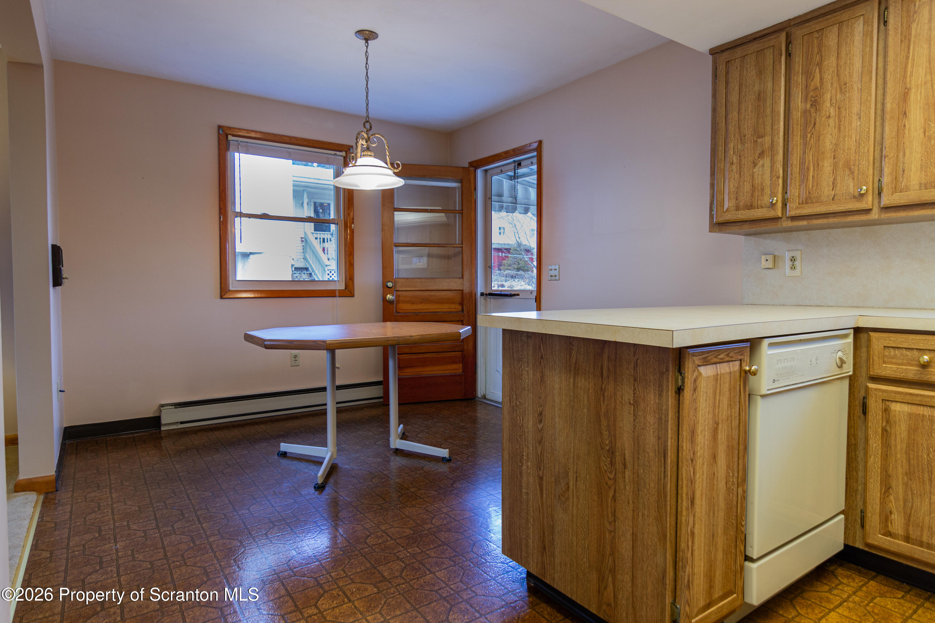 1215 Mine Street Old Forge, PA 18518 - Photo 19 of 34 a dining room with furniture window and wooden floor