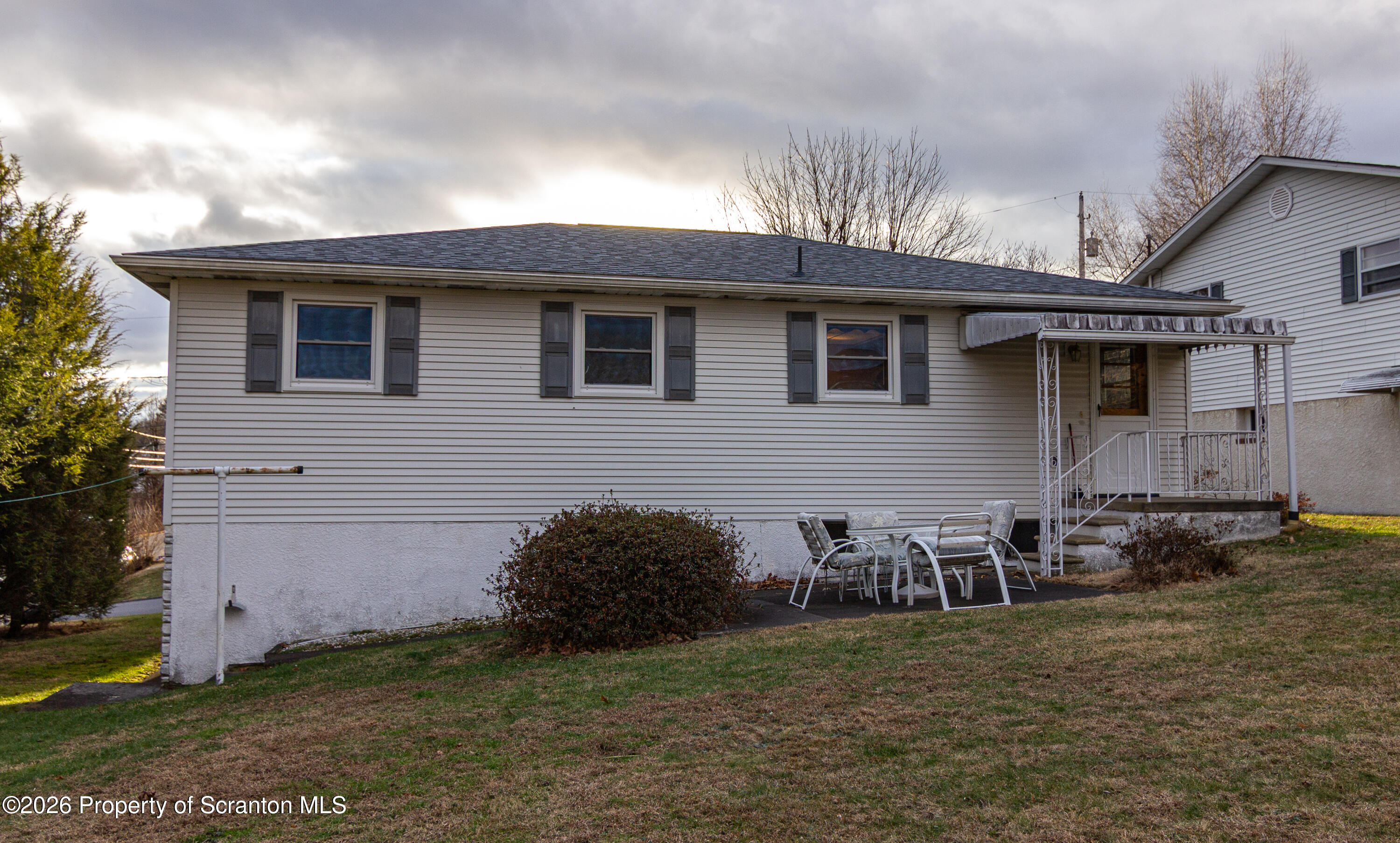 1215 Mine Street Old Forge, PA 18518 - Photo 2 of 34 a backyard of a house with table and chairs
