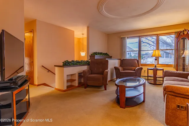 a view of a room with wooden walls