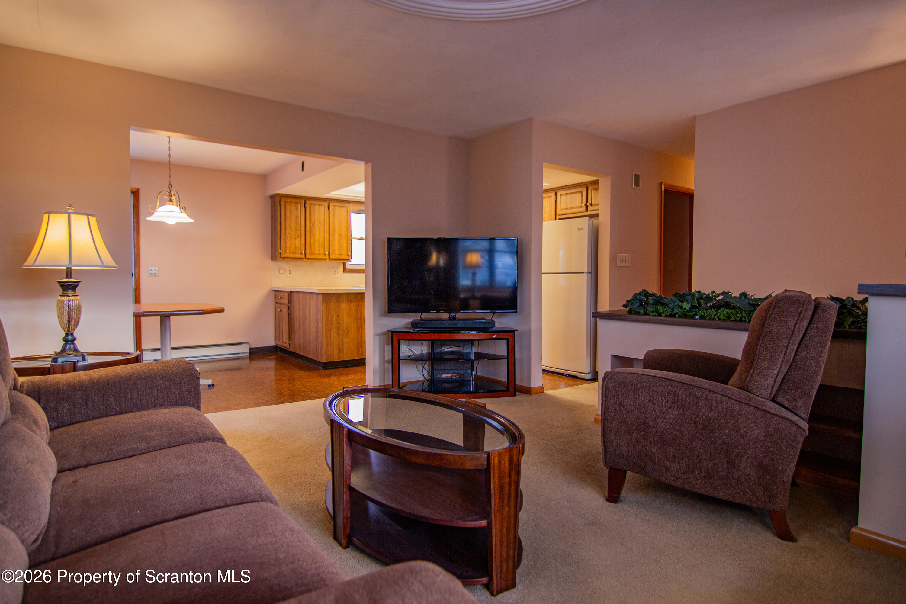 1215 Mine Street Old Forge, PA 18518 - Photo 25 of 34 a living room with furniture and a flat screen tv