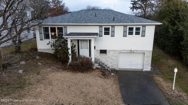a view of a chairs and table in the yard