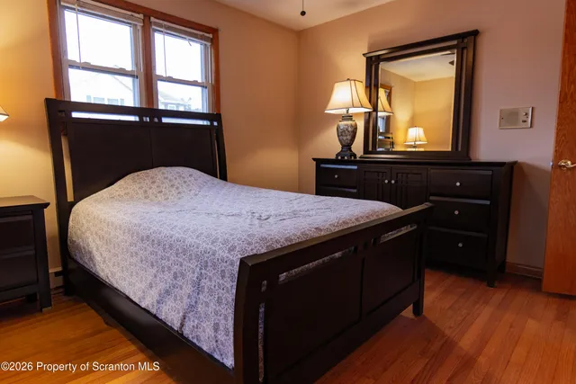 a bed room with a bed and a mirror