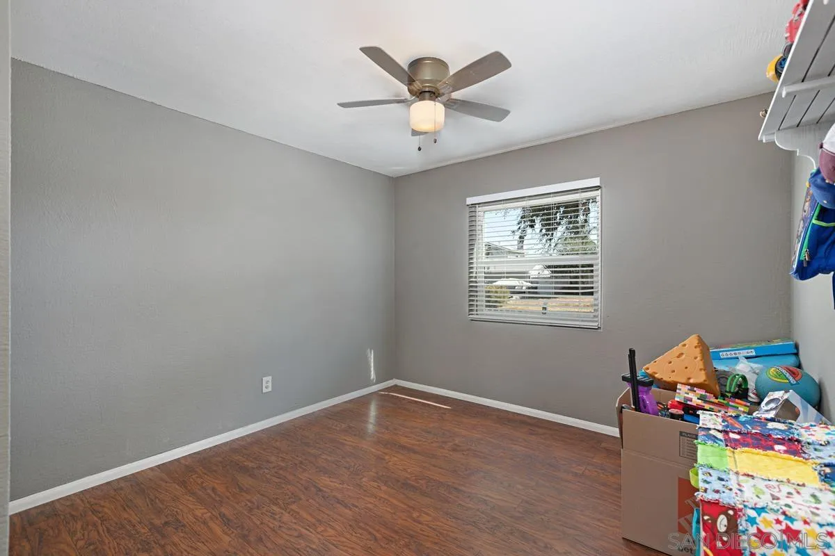 9452 Pike Road Santee, CA 92071 - Photo 13 of 26 an empty room with toys and wooden floor