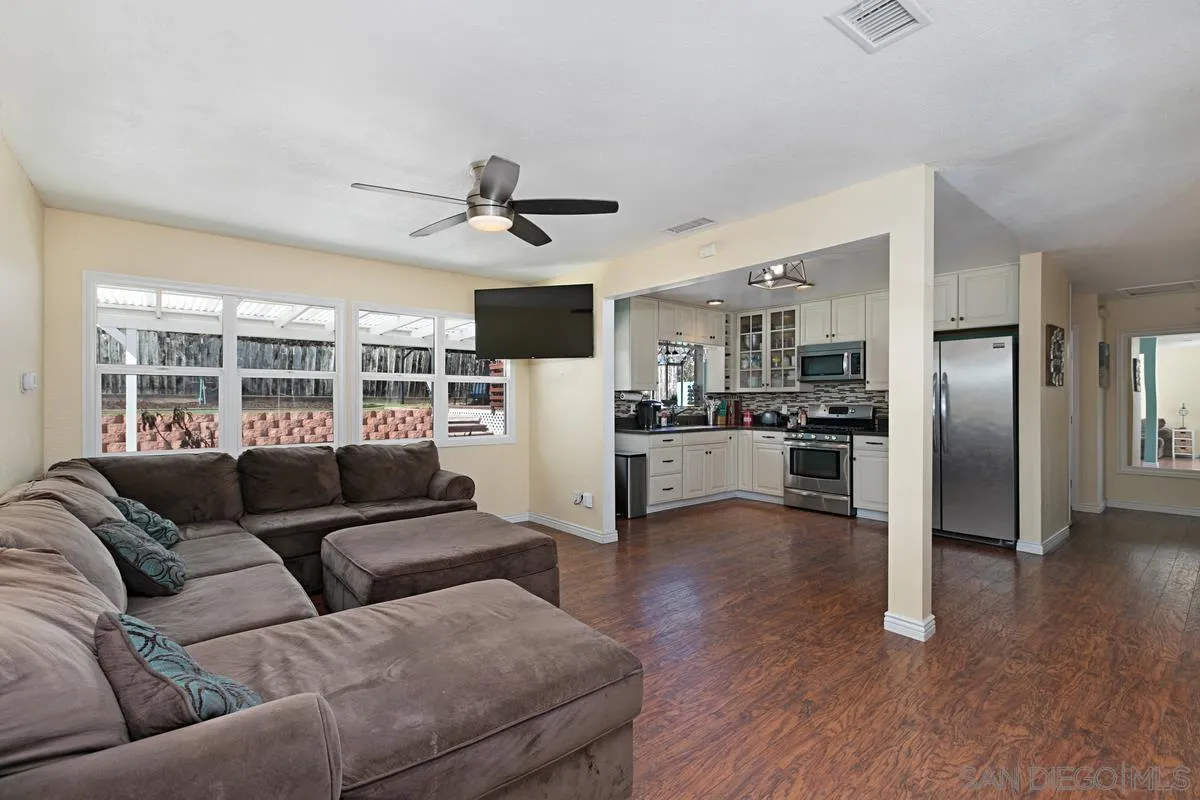9452 Pike Road Santee, CA 92071 - Photo 8 of 26 a living room with furniture and a kitchen view