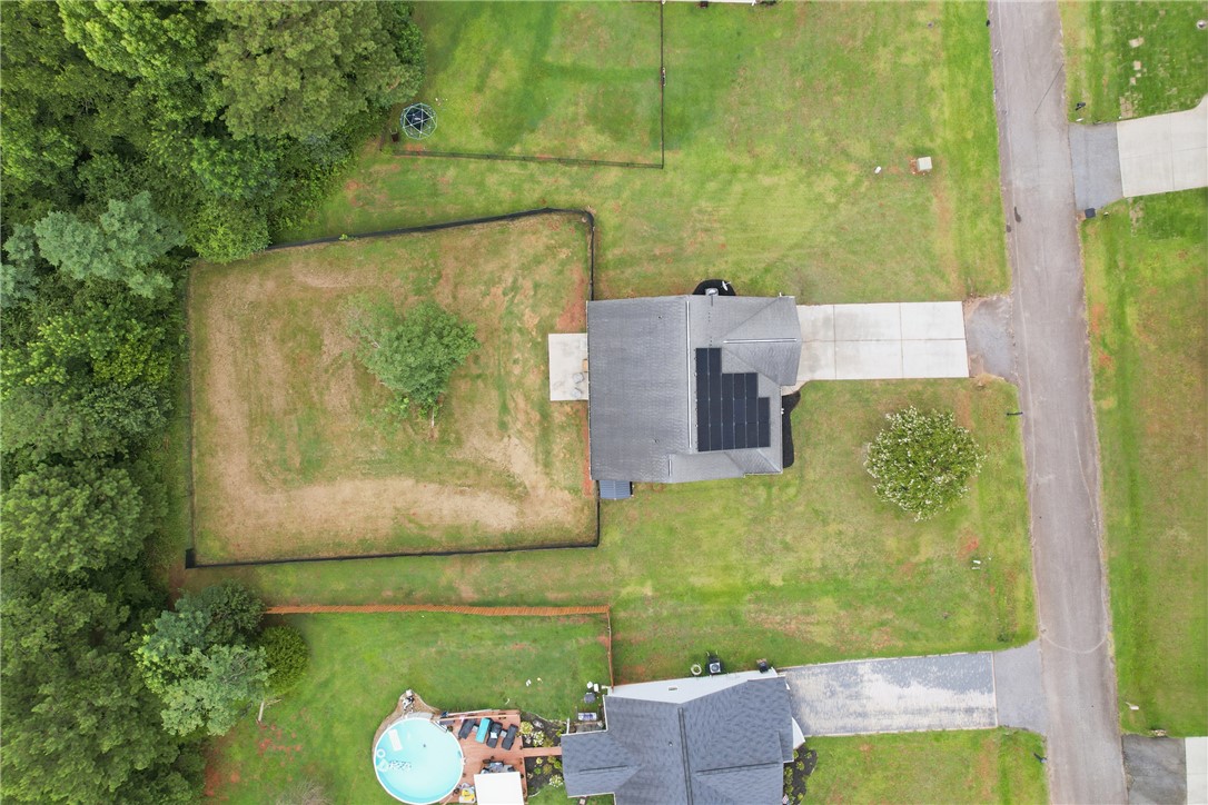 105 Lacy Lane Anderson, SC 29621 - Photo 16 of 16 An aerial perspective reveals a residence with a solar-equipped roof and an expansive lot.