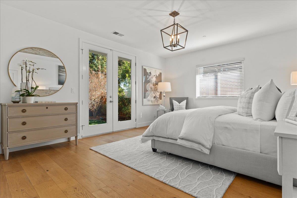 1233 Crompton Road Redwood City, CA 94061 - Photo 13 of 28 a spacious bedroom with a large bed and a dresser