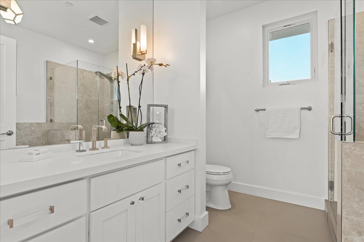 1233 Crompton Road Redwood City, CA 94061 - Photo 15 of 28 a bathroom with a granite countertop sink a toilet and a mirror