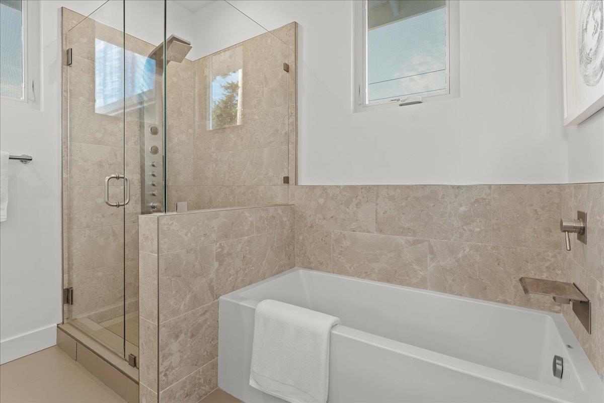 1233 Crompton Road Redwood City, CA 94061 - Photo 16 of 28 a bathroom with a bathtub and a shower